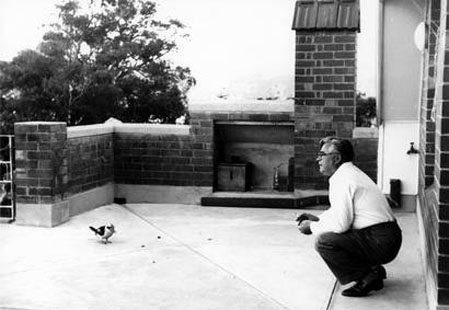 Vladimir Petrov feeding a kookaburra at the ASIO safe house on Sydney’s North Shore following his defection. Image courtesy of the National Archives of Australia.