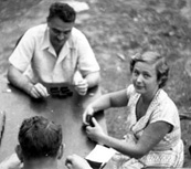 Evdokia Petrov playing dominoes with ASIO agents, including Ron Richards. Photograph presented as evidence to the Royal Commission on Espionage, 1954
