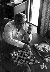 Vladimir Petrov playing chess inside the safe house in which he and his wife were held immediately following their defection to Australia. The photograph was presented as evidence to the Royal Commission on Espionage in 1954.